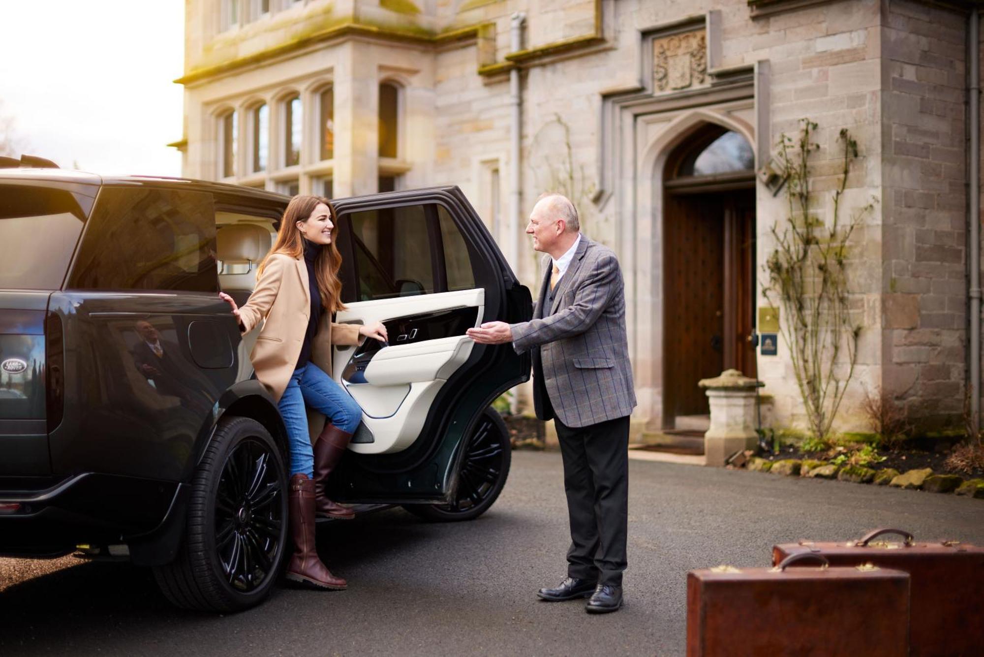 Schloss Roxburghe, Part Of Destination By Hyatt Luaran gambar A chauffeur opening the car door for a passenger
